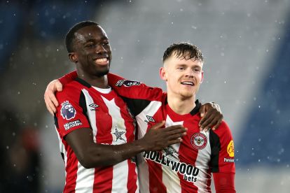 LEICESTER, ENGLAND - FEBRUARY 21: Michael Kayode and Keane Lewis-Potter of Brentford embrace as they show appreciation to the fans at full-time following the team's victory in the Premier League match between Leicester City FC and Brentford FC at The King Power Stadium on February 21, 2025 in Leicester, England. (Photo by Mark Thompson/Getty Images)