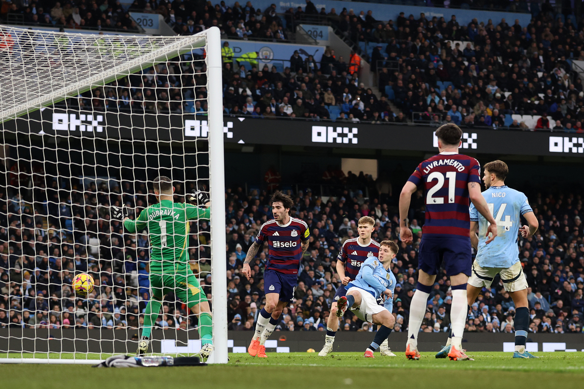 James McAtee of Manchester City scores his team's fourth goal during the Premier League match between Manchester City FC and Newcastle United FC at Etihad Stadium on February 15, 2025 in Manchester, England. (Photo by Carl Recine/Getty Images)
