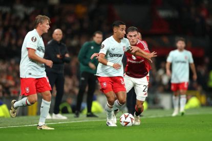 MANCHESTER, ENGLAND - SEPTEMBER 25: Anass Salah-Eddine of FC Twente is challenged by Manuel Ugarte of Manchester United during the UEFA Europa League 2024/25 League Phase MD1 match between Manchester United and FC Twente at Old Trafford on September 25, 2024 in Manchester, England. (Photo by Carl Recine/Getty Images)