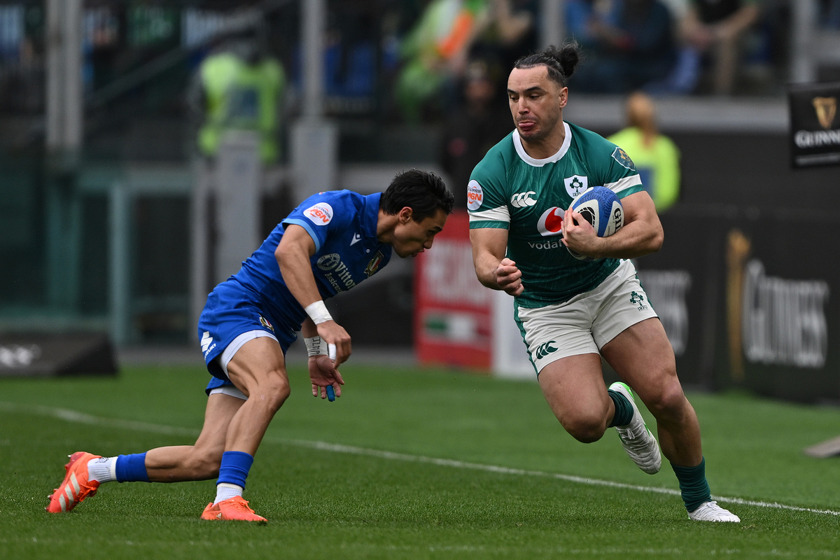 ROME, ITALY - MARCH 15: James Lowe of Ireland is challenged by Ange Capuozzo of Italy during the Guinness Six Nations 2025 match between Italy and Ireland at Stadio Olimpico on March 15, 2025 in Rome, Italy. (Photo by Mike Hewitt/Getty Images)