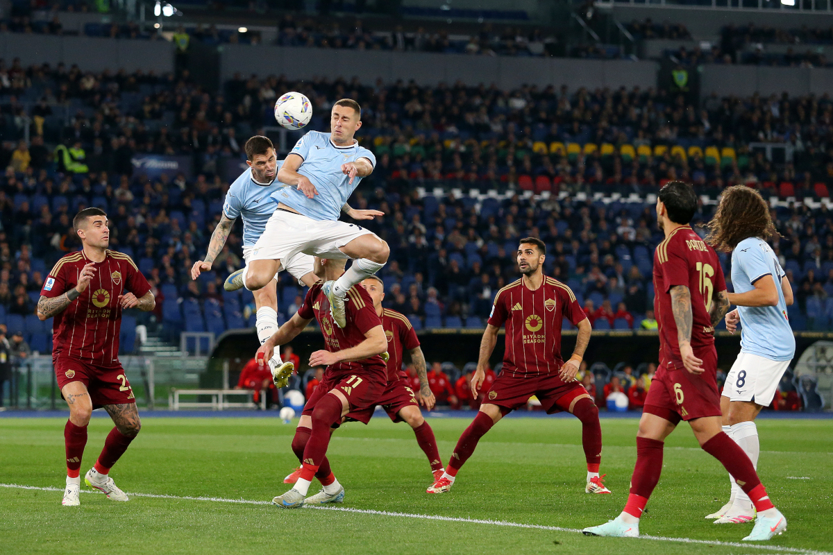 ROME, ITALY - APRIL 13: Alessio Romagnoli and Adam Marusic of Lazio compete for a header during the Serie A match between SS Lazio and AS Roma at Stadio Olimpico on April 13, 2025 in Rome, Italy. (Photo by Paolo Bruno/Getty Images)