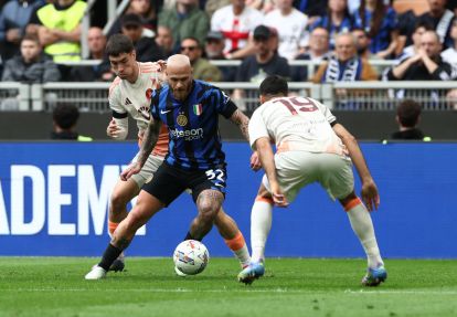 MILAN, ITALY - APRIL 27: Federico Dimarco of FC Internazionale controls the ball whilst under pressure from Matias Soule and Zeki Celik of AS Roma during the Serie A match between FC Internazionale and AS Roma at Stadio Giuseppe Meazza on April 27, 2025 in Milan, Italy. (Photo by Marco Luzzani/Getty Images)