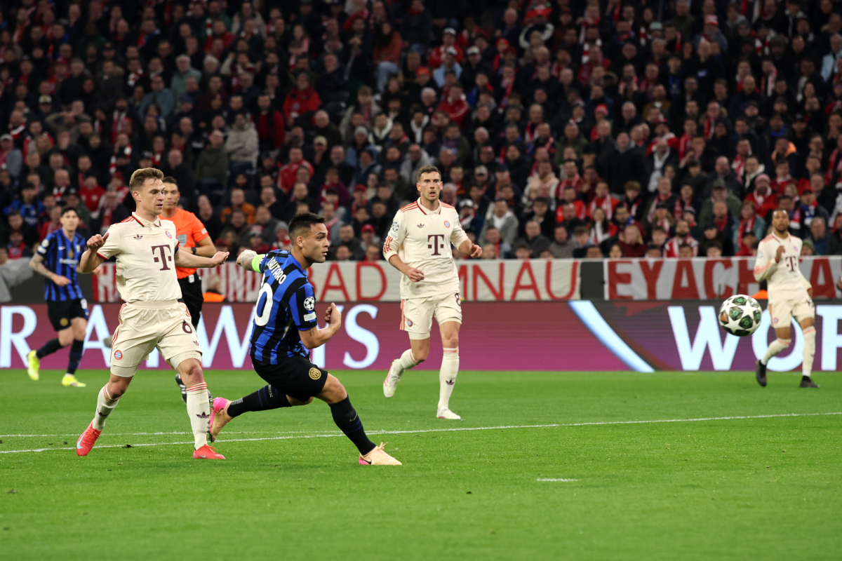 MUNICH, GERMANY - APRIL 08: Lautaro Martinez of FC Internazionale scores his team's first goal under pressure from Joshua Kimmich of Bayern Munich during the UEFA Champions League 2024/25 Quarter Final First Leg match between FC Bayern München and FC Internazionale Milano at Fussball Arena Muenchen on April 08, 2025 in Munich, Germany. (Photo by Alex Grimm/Getty Images)