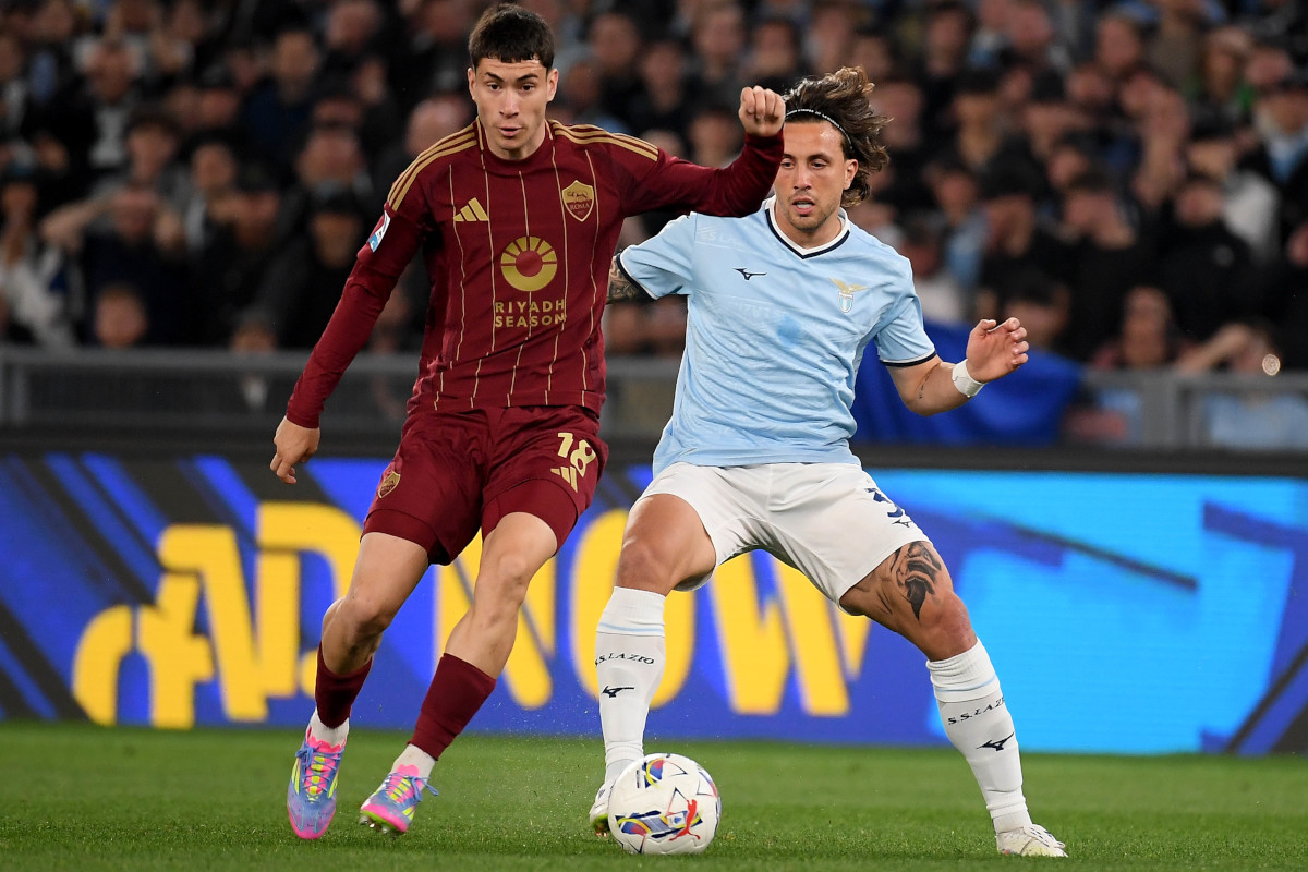 ROME, ITALY - APRIL 13: Luca Pellegrini of SS Lazio compete for the ball with Matias Soulè of AS Roma during the Serie A match between Lazio and Roma at Stadio Olimpico on April 13, 2025 in Rome, Italy. (Photo by Marco Rosi - SS Lazio/Getty Images)