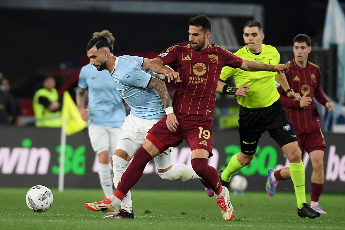 ROME, ITALY - APRIL 13: Valentin Castellanos of SS Lazio compete for the ball with Zeki Celik of AS Roma during the Serie A match between Lazio and Roma at Stadio Olimpico on April 13, 2025 in Rome, Italy. (Photo by Marco Rosi - SS Lazio/Getty Images)