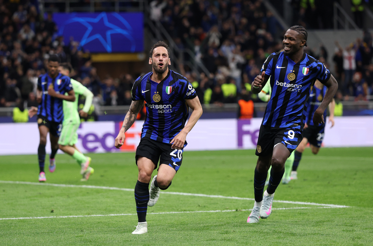 Milan, Italy - May 6: Hakan Calhanoglu of FC Internazionale (L) celebrates the team's second goal with teammate Marcus Thuram (R) in the final second leg match of the UEFA Champions League 2024/25 between FC Internazionale Milano and FC Barcelona. (Photos Recine/Getty Images)
