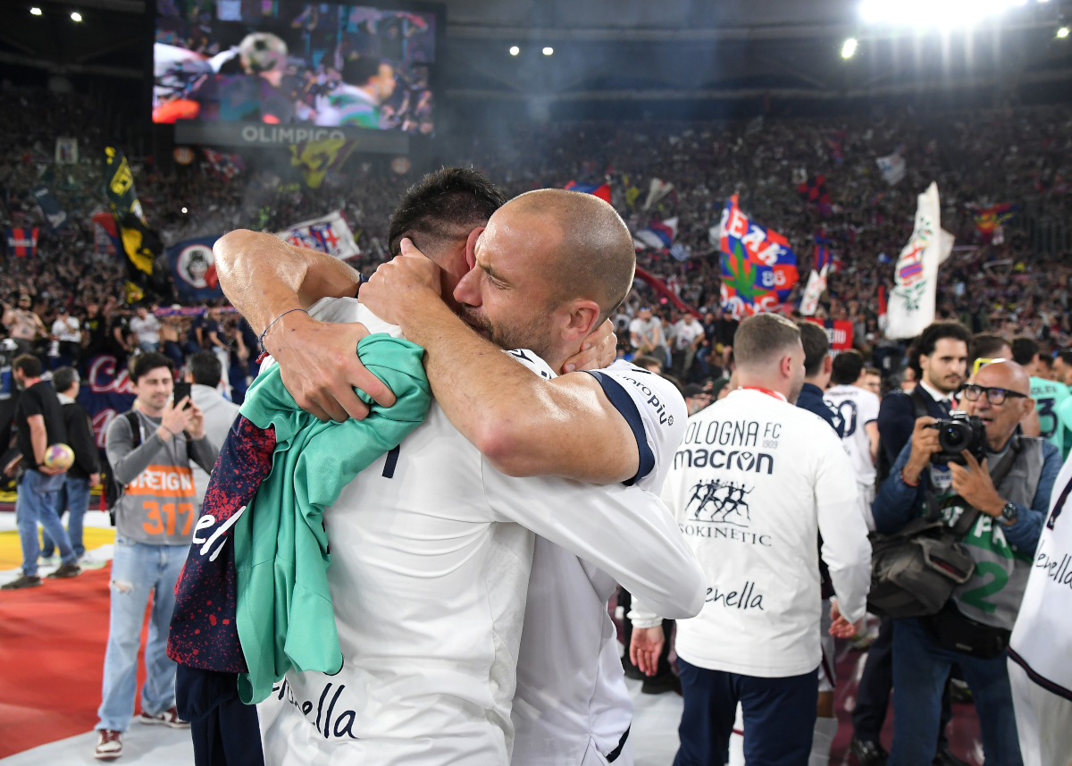 ROME, ITALY - MAY 14: Lorenzo De Silvestri of Bologna celebrates with a team mate after the team's victory in the Coppa Italia Final match between AC Milan and Bologna at Stadio Olimpico on May 14, 2025 in Rome, Italy. (Photo by Marco Rosi/Getty Images)