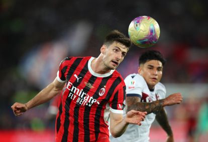 ROME, ITALY - MAY 14: Matteo Gabbia of AC Milan wins a header during the Coppa Italia Final match between AC Milan and Bologna at Stadio Olimpico on May 14, 2025 in Rome, Italy. (Photo by Paolo Bruno/Getty Images)