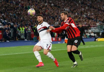 ROME, ITALY - MAY 14: Riccardo Orsolini of Bologna is challenged by Theo Hernandez of AC Milan during the Coppa Italia Final match between AC Milan and Bologna at Stadio Olimpico on May 14, 2025 in Rome, Italy. (Photo by Paolo Bruno/Getty Images)
