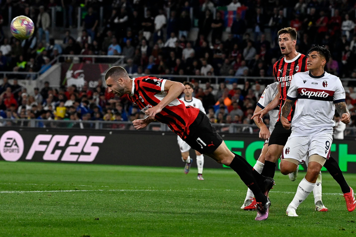 epa12100691 Milan’s Strahinja Pavlovic (L) in action during the Italian Cup final soccer match between AC Milan and Bologna FC in Rome, Italy, 14 May 2025. EPA-EFE/Riccardo Antimiani