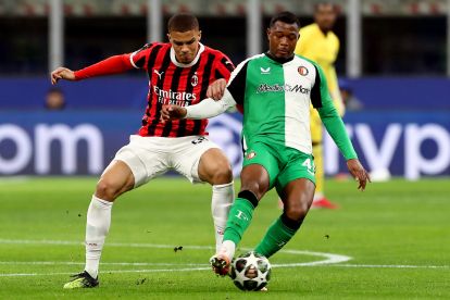 MILAN, ITALY - FEBRUARY 18: Zepiqueno Redmond of Feyenoord is challenged by Malick Thiaw of AC Milan during the UEFA Champions League 2024/25 League Knockout Play-off second leg match between AC Milan and Feyenoord at San Siro Stadium on February 18, 2025 in Milan, Italy. (Photo by Marco Luzzani/Getty Images)