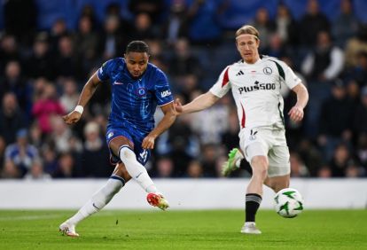 LONDON, ENGLAND - APRIL 17: Christopher Nkunku of Chelsea shoots whilst under pressure from Radovan Pankov of Legia Warszawa during the UEFA Conference League 2024/25 Quarter Final Second Leg match between Chelsea FC and Legia Warszawa at Stamford Bridge on April 17, 2025 in London, England. (Photo by Mike Hewitt/Getty Images)