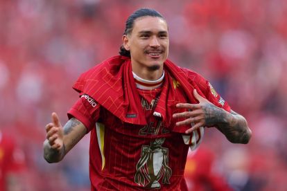 LIVERPOOL, ENGLAND - APRIL 27: Darwin Nunez of Liverpool celebrates the teams victory and confirmation of winning the Premier League title after the Premier League match between Liverpool FC and Tottenham Hotspur FC at Anfield on April 27, 2025 in Liverpool, England. (Photo by Carl Recine/Getty Images) (Milan links)