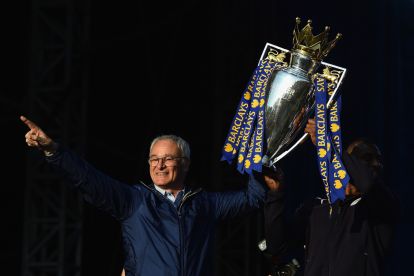 LEICESTER, ENGLAND - MAY 16:  (L-R) Claudio Ranieri Manager of Leicester City and captain Wes Morgan of Leicester City show the trophy to the fans during the Leicester City Barclays Premier League winners bus parade on May 16, 2016 in Leicester, England.  (Photo by Laurence Griffiths/Getty Images)