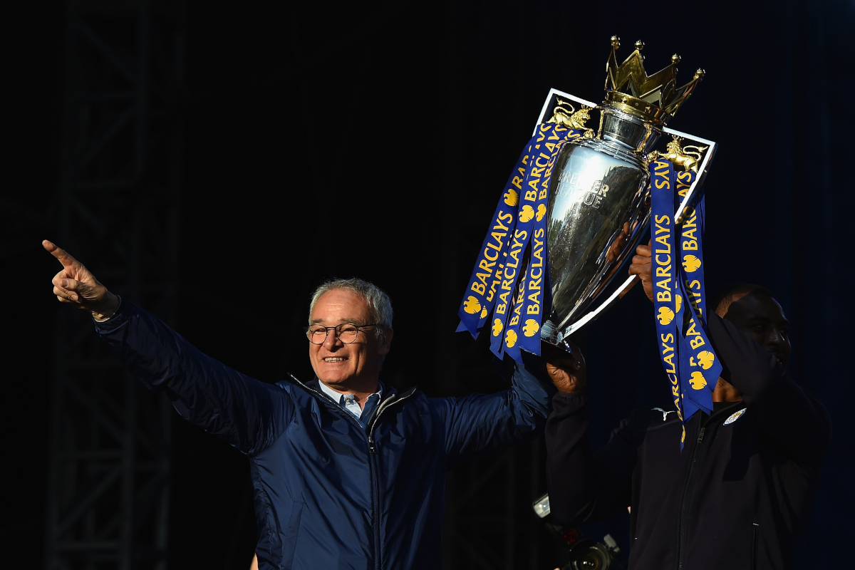 LEICESTER, ENGLAND - MAY 16: (L-R) Claudio Ranieri Manager of Leicester City and captain Wes Morgan of Leicester City show the trophy to the fans during the Leicester City Barclays Premier League winners bus parade on May 16, 2016 in Leicester, England. (Photo by Laurence Griffiths/Getty Images)