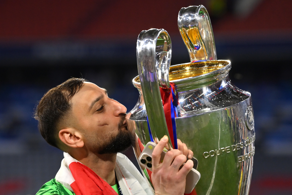 MUNICH, GERMANY - MAY 31: Gianluigi Donnarumma of Paris Saint-Germain kisses the UEFA Champions League trophy after his team's victory, to secure Paris Saint-Germain's first ever UEFA Champions League title in the club's history and a record UEFA Champions League Final winning scoreline of 5-0, following the UEFA Champions League Final 2025 between Paris Saint-Germain and FC Internazionale Milano at Munich Football Arena on May 31, 2025 in Munich, Germany. (Photo by Justin Setterfield/Getty Images)
