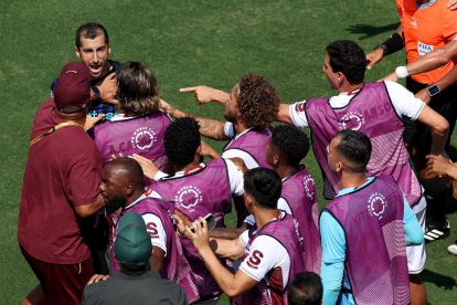 CHARLOTTE, NORTH CAROLINA - JUNE 30: Henrikh Mkhitaryan #22 of FC Internazionale Milano clashes with substitutes and Renato Portaluppi, Head Coach of Fluminense FC, on the Fluminense FC bench during the FIFA Club World Cup 2025 round of 16 match between FC Internazionale Milano and Fluminense FC at Bank of America Stadium on June 30, 2025 in Charlotte, North Carolina. (Photo by Buda Mendes/Getty Images)