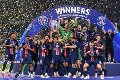 MUNICH, GERMANY - MAY 31: Marquinhos of Paris Saint-Germain lifts the UEFA Champions League trophy after his team's victory, to secure Paris Saint-Germain's first ever UEFA Champions League title in the club's history and a record UEFA Champions League Final winning scoreline of 5-0, following the UEFA Champions League Final 2025 between Paris Saint-Germain and FC Internazionale Milano at Munich Football Arena on May 31, 2025 in Munich, Germany. (Photo by Justin Setterfield/Getty Images)