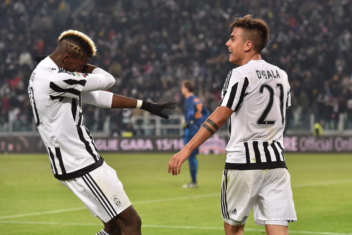 TURIN, ITALY - JANUARY 24: Paulo Dybala (R) of Juventus FC celebrates after scoring the opening goal with team mate Paul Pogba during the Serie A match between Juventus FC and AS Roma at Juventus Arena on January 24, 2016 in Turin, Italy. (Photo by Valerio Pennicino/Getty Images)