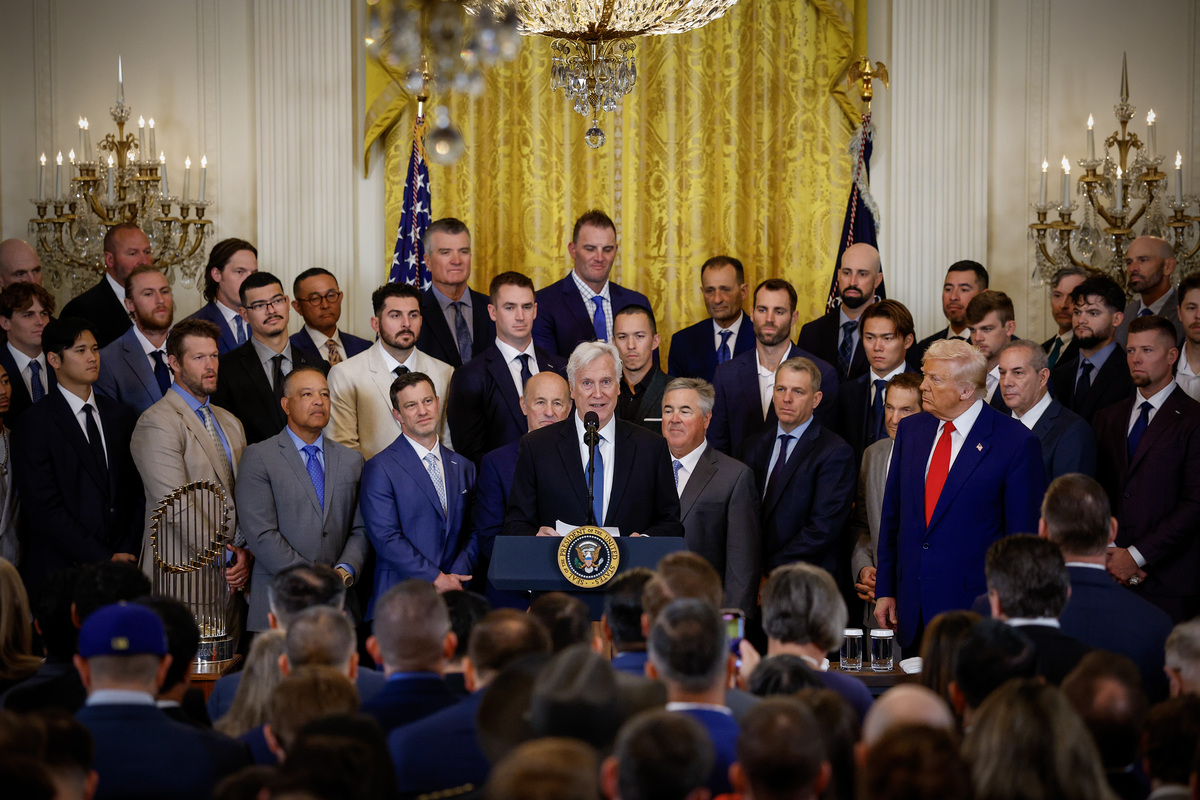 WASHINGTON, DC - APRIL 07: Los Angeles Dodgers Owner and Chairman Mark Walter (C), accompanied by U.S. President Donald Trump (R), speaks as Trump hosts the 2024 World Series champions in the East Room of the White House on April 07, 2025 in Washington, DC. The Los Angeles Dodgers defeated the New York Yankees with a 7-6 victory in Game 5. (Photo by Kevin Dietsch/Getty Images)
