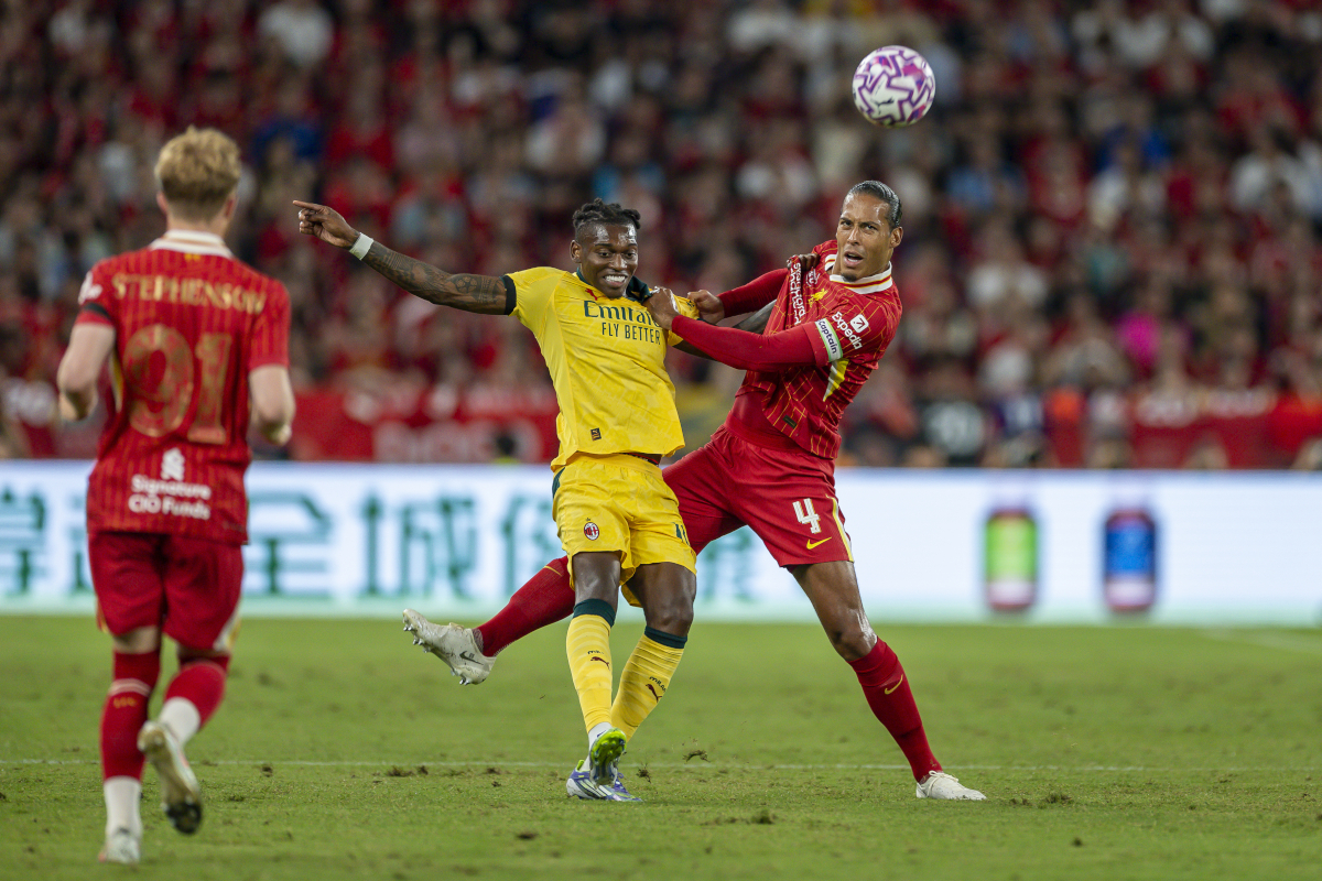 HONG KONG, CHINA - JULY 26: Rafael Leao of AC Milan (C) and Virgil van Dijk of Liverpool (R) fight for the ball during the Liverpool FC v AC Milan Pre-Season Friendly match at Kai Tak Stadium on July 26, 2025 in Hong Kong, China. (Photo by Yu Chun Christopher Wong/Eurasia Sport Images/Getty Images)