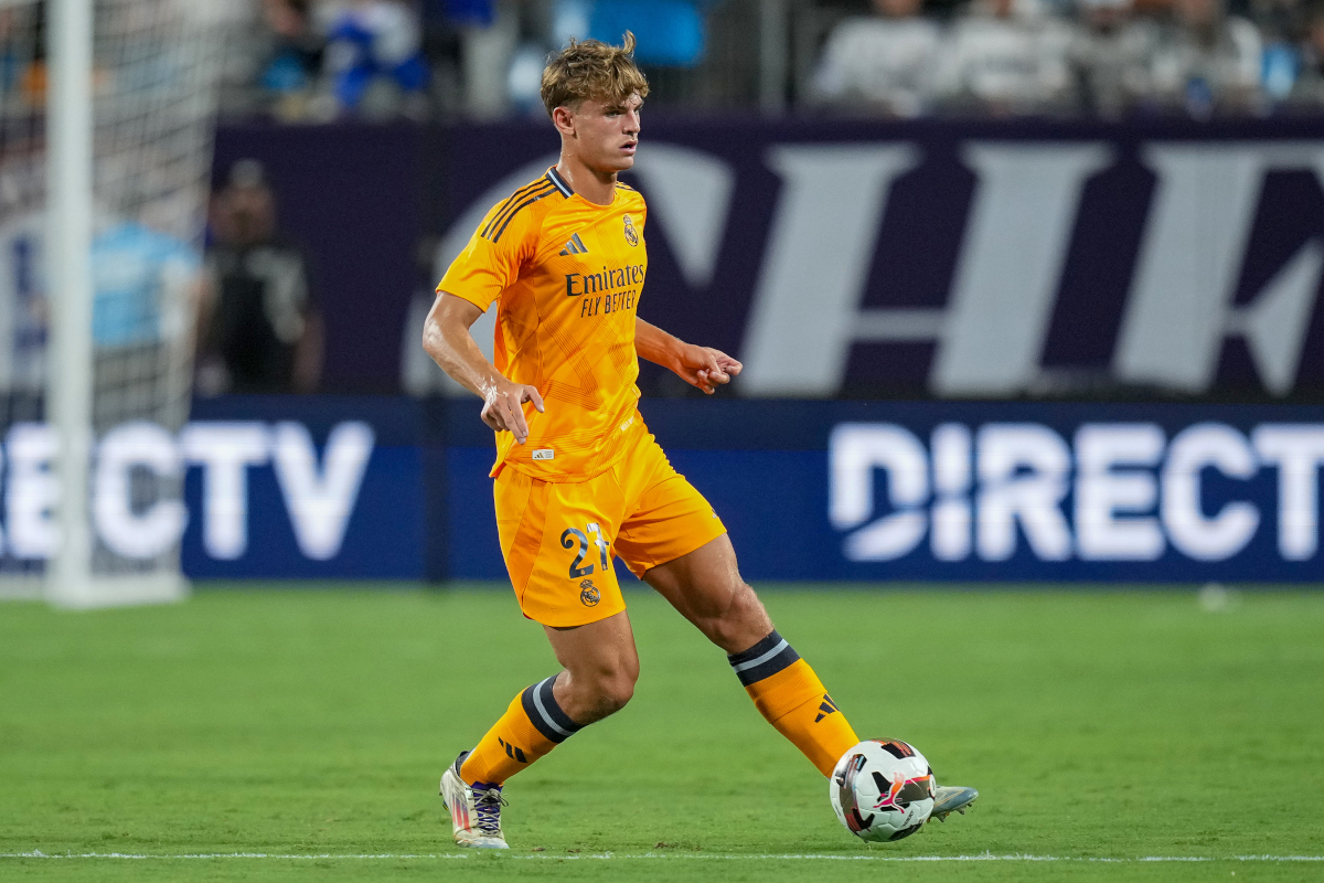 CHARLOTTE, NORTH CAROLINA - AUGUST 06: Rafael Obrador #27 of Real Madrid moves the ball against Chelsea during a pre-season friendly match at Bank of America Stadium on August 06, 2024 in Charlotte, North Carolina. (Photo by Grant Halverson/Getty Images)