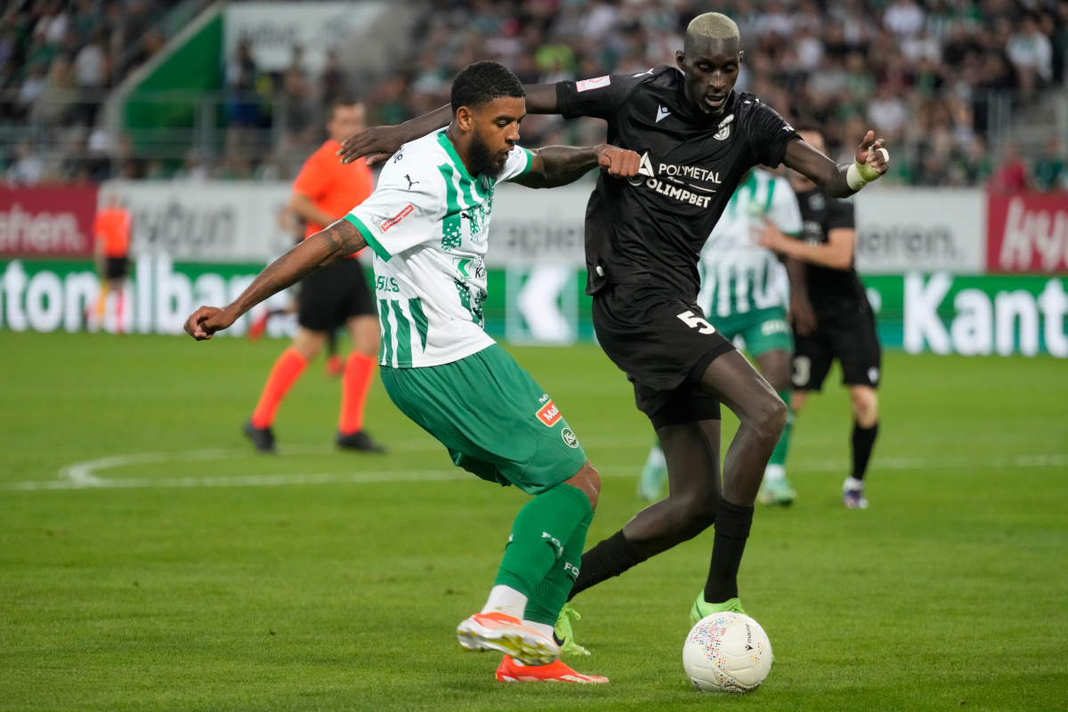 ST GALLEN, SWITZERLAND - JULY 25: Willem Geubbels of Saint Gallen and Pape Alioune Ndiaye of Tobol fight for the ball during the UEFA Conference League second qualifying round first leg match between St. Gallen and Tobol on July 25, 2024 in St Gallen, Switzerland. (Photo by Carsten Harz/Getty Images)