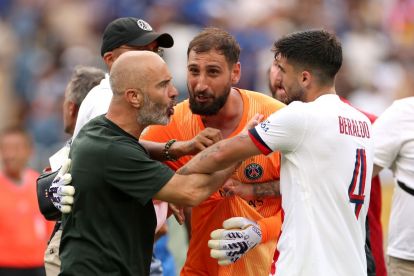 EAST RUTHERFORD, NEW JERSEY - JULY 13: Gianluigi Donnarumma #1 of Paris Saint-Germain engages with Enzo Maresca, Head Coach of Chelsea FC, and Lucas Beraldo #4 following the FIFA Club World Cup 2025 Final match between Chelsea FC and Paris Saint-Germain at MetLife Stadium on July 13, 2025 in East Rutherford, New Jersey. (Photo by Luke Hales/Getty Images)