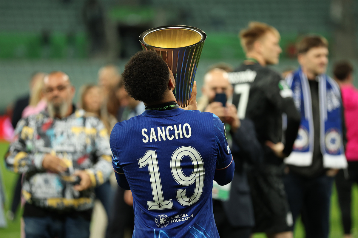WROCLAW, POLAND - MAY 28: Jadon Sancho of Chelsea celebrates with the UEFA Conference League trophy after his team's victory in the UEFA Conference League Final 2025 between Real Betis Balompie and Chelsea FC at Stadion Wroclaw on May 28, 2025 in Wroclaw, Poland. (Photo by Richard Heathcote/Getty Images)
