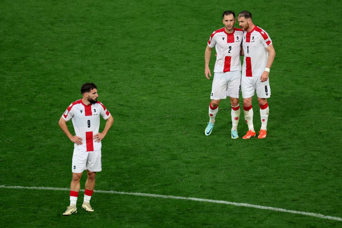 DORTMUND, GERMANY - JUNE 18: Zuriko Davitashvili of Georgia looks dejected as Otar Kakabadze and Budu Zivzivadze react after the UEFA EURO 2024 group stage match between Turkiye and Georgia at Football Stadium Dortmund on June 18, 2024 in Dortmund, Germany. (Photo by Kevin C. Cox/Getty Images)