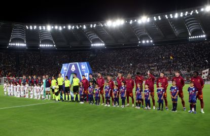 ROME, ITALY - AUGUST 23: Players, match officials and mascots line up prior to the Serie A match between AS Roma and Bologna FC 1909 at Stadio Olimpico on August 23, 2025 in Rome, Italy. (Photo by Paolo Bruno/Getty Images)