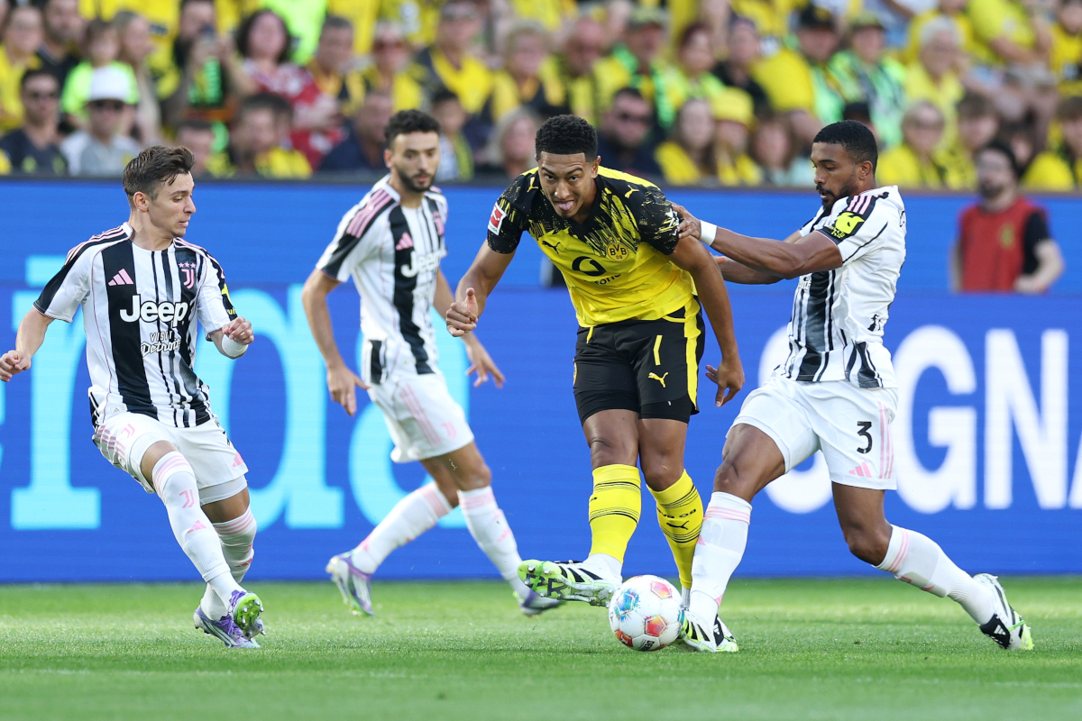 DORTMUND, GERMANY - AUGUST 10: Jobe Bellingham of Borussia Dortmund is put under pressure by Bremer of Juventus during the pre-season friendly match between Borussia Dortmund and Juventus FC at Signal Iduna Park on August 10, 2025 in Dortmund, Germany. (Photo by Lars Baron/Getty Images)