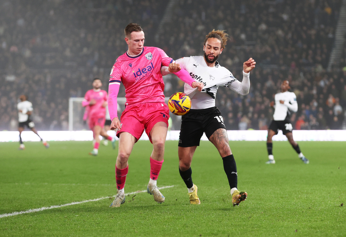 DERBY, ENGLAND - DECEMBER 26: Torbjorn Heggem of West Bromwich Albion is challenged by Marcus Harness of Derby County during the Sky Bet Championship match between Derby County FC and West Bromwich Albion FC at Pride Park on December 26, 2024 in Derby, England. (Photo by Cameron Smith/Getty Images)
