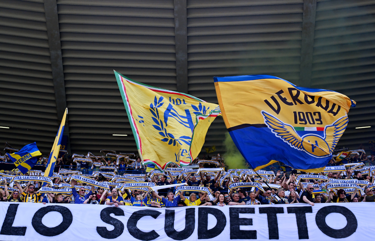 VERONA, ITALY - MAY 11: Fans of Hellas Verona show their support by waving large flags in the stands during the Serie A match between Verona and Lecce at Stadio Marcantonio Bentegodi on May 11, 2025 in Verona, Italy. (Photo by Alessandro Sabattini/Getty Images)