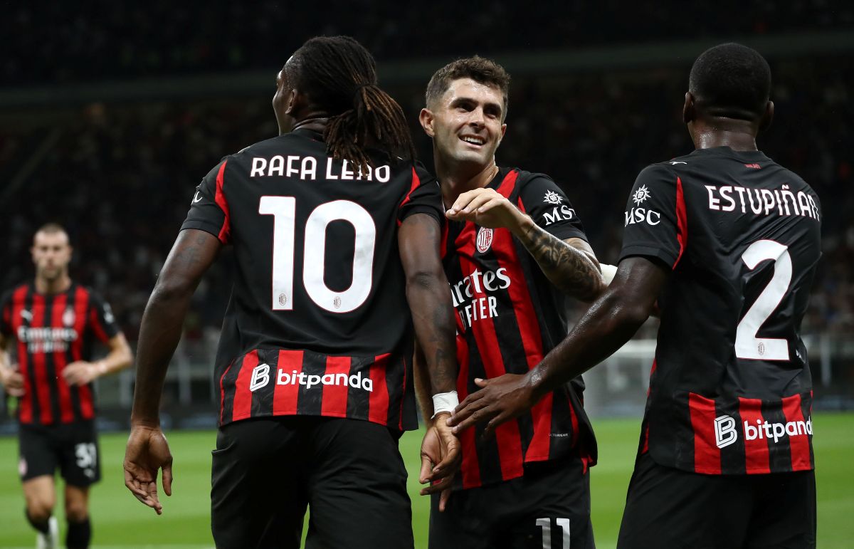 MILAN, ITALY - AUGUST 17: Rafael Leao of AC Milan celebrates with his team-mate Christian Pulisic after scoring the opening goal during the Coppa Italia match between AC Milan and SSC Bari at Stadio San Siro on August 17, 2025 in Milan, Italy. (Photo by Marco Luzzani/Getty Images)