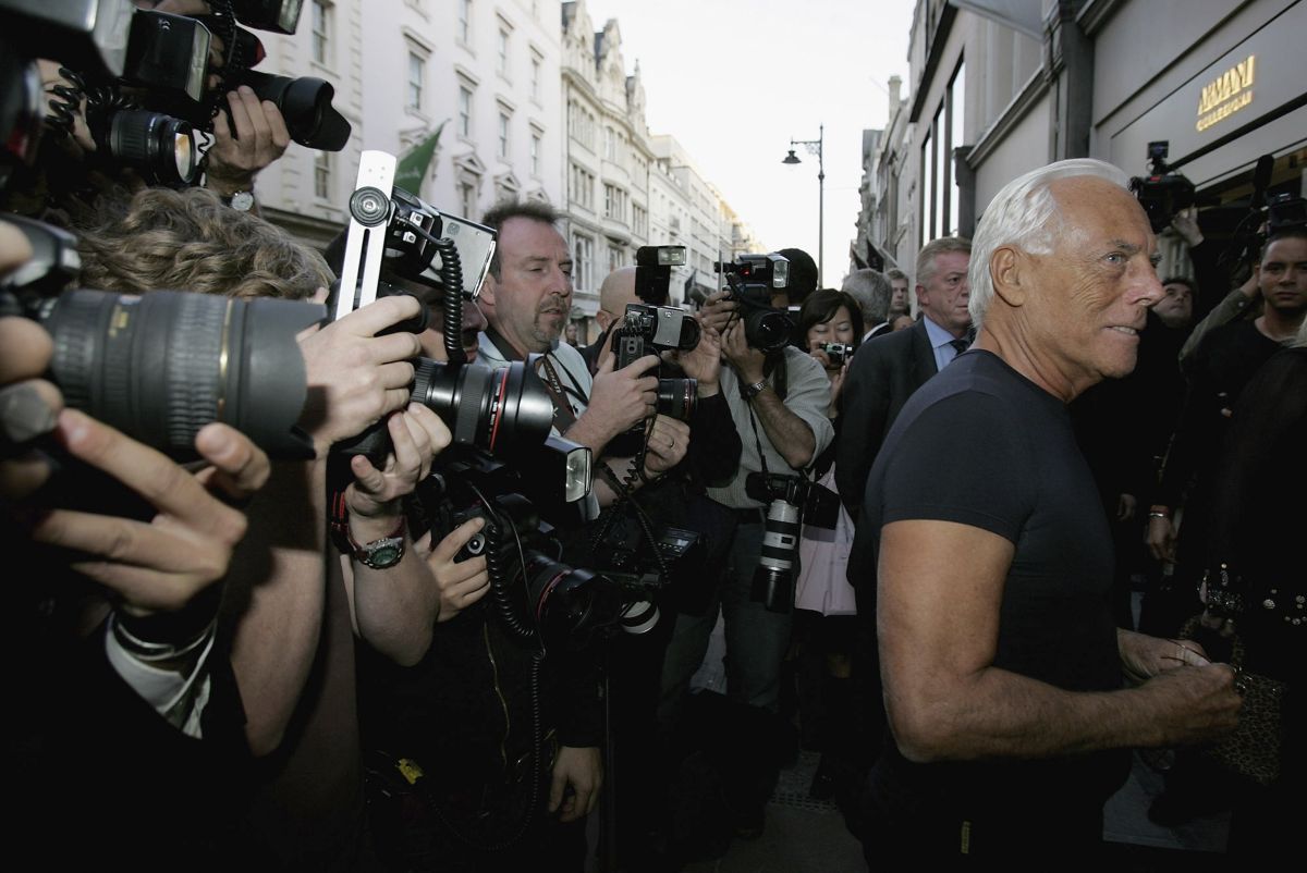 LONDON - SEPTEMBER 20: Giorgio Armani (R) waits for the arrival of Chelsea football player Andriy Shevchenko outside the new Armani Casa store on New Bond Street on September 20, 2006 in London, England. Giorgio Armani and Andriy Shevchenko help celebratethe publication of 'Sheva' and the opening of the Armani Casa flagship store in New Bond Street on September 20, 2006 in London, England. (Photo by Christopher Lee/Getty Images)