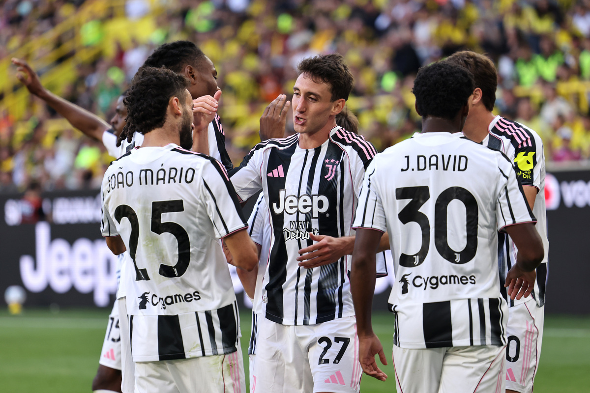 DORTMUND, GERMANY - AUGUST 10: Andrea Cambiaso of Juventus celebrates scoring his team's second goal with teammate Joao Mario during the pre-season friendly match between Borussia Dortmund and Juventus FC at Signal Iduna Park on August 10, 2025 in Dortmund, Germany. (Photo by Christof Koepsel/Getty Images)