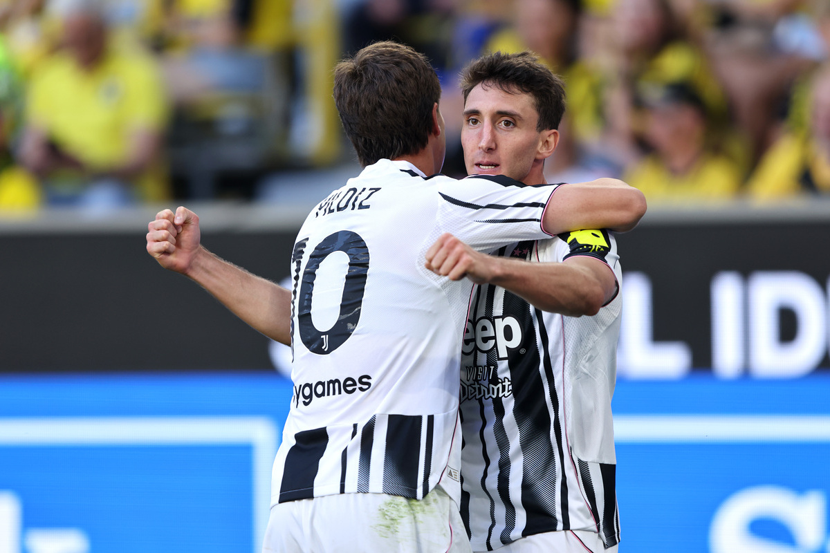 DORTMUND, GERMANY - AUGUST 10: Andrea Cambiaso of Juventus celebrates scoring his team's second goal with teammate Kenan Yildiz during the pre-season friendly match between Borussia Dortmund and Juventus FC at Signal Iduna Park on August 10, 2025 in Dortmund, Germany. (Photo by Christof Koepsel/Getty Images)