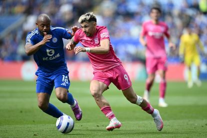 LEICESTER, ENGLAND - MAY 18: Julio Enciso of Ipswich Town runs with the ball whilst under pressure from Jordan Ayew of Leicester City during the Premier League match between Leicester City FC and Ipswich Town FC at The King Power Stadium on May 18, 2025 in Leicester, England. (Photo by Gareth Copley/Getty Images)