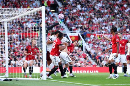 MANCHESTER, ENGLAND - AUGUST 17: Altay Bayindir of Manchester United fails to save a header which leads to the first goal for Arsenal scored by Riccardo Calafiori of Arsenal during the Premier League match between Manchester United and Arsenal at Old Trafford on August 17, 2025 in Manchester, England. (Photo by Michael Regan/Getty Images)