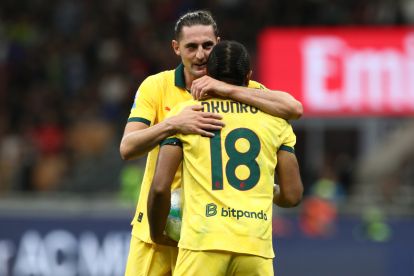MILAN, ITALY - SEPTEMBER 14: Adrien Rabiot of AC Milan hugs teammate Christopher Nkunku during the Serie A match between AC Milan and Bologna FC 1909 at Giuseppe Meazza Stadium on September 14, 2025 in Milan, Italy. (Photo by Marco Luzzani/Getty Images)