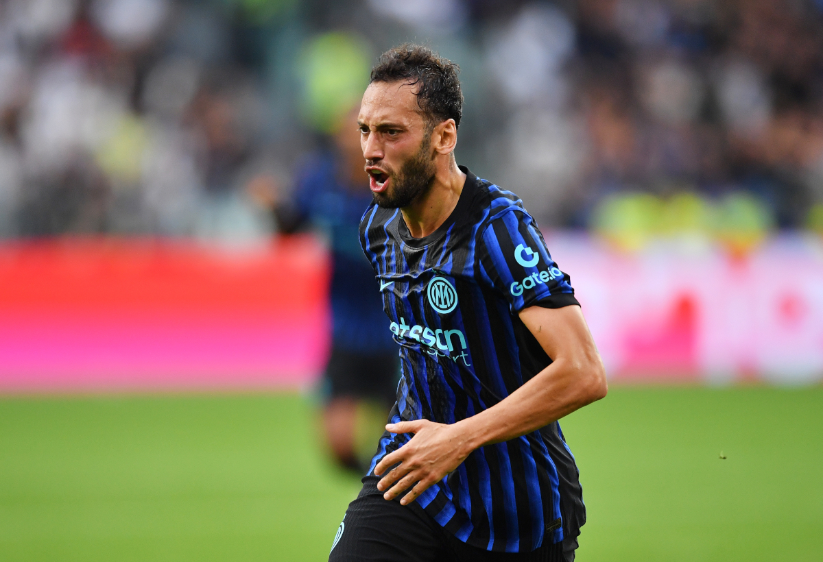 Hakan Calhanoglu of Internazionale celebrates scoring his team`s first goal during the Serie A match between Juventus FC and FC Internazionale