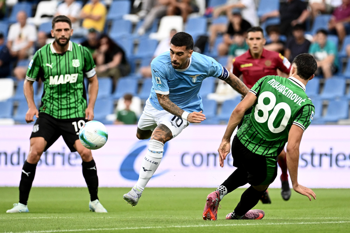 SASSUOLO, ITALY - SEPTEMBER 14: Mattia Zaccagni of SS Lazio compete for the ball with Tarik Muharemovic of US Sassuolo during the Serie A match between US Sassuolo Calcio and SS Lazio at Mapei Stadium Citta del Tricolore on September 14, 2025 in Sassuolo, Italy. (Photo by Marco Rosi - SS Lazio/Getty Images)