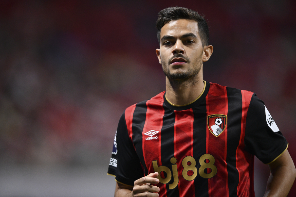 Romain Faivre in AFC Bournemouth kit running on field