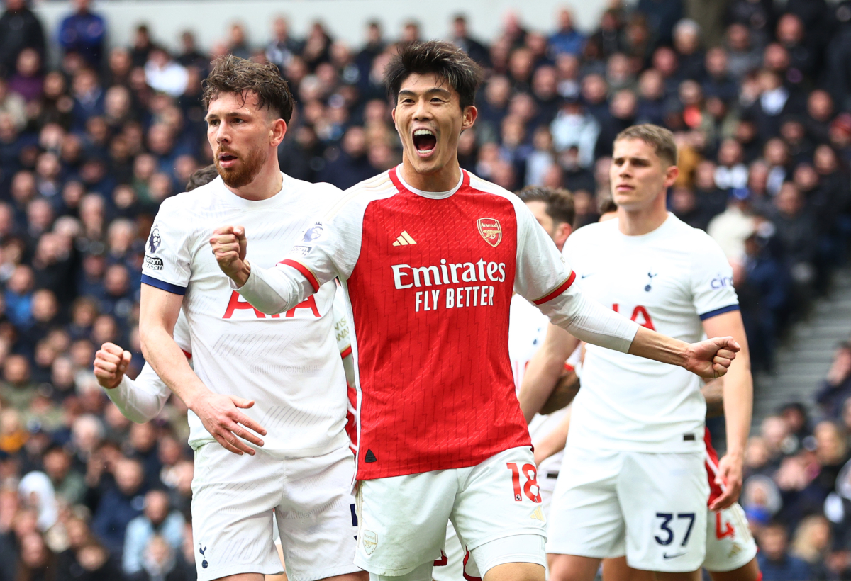 LONDON, ENGLAND - APRIL 28: Takehiro Tomiyasu of Arsenal celebrates after Pierre-Emile Hojbjerg of Tottenham Hotspur scored an own goal, Arsenal's first goal during the Premier League match between Tottenham Hotspur and Arsenal FC at Tottenham Hotspur Stadium on April 28, 2024 in London, England. (Photo by Clive Rose/Getty Images)