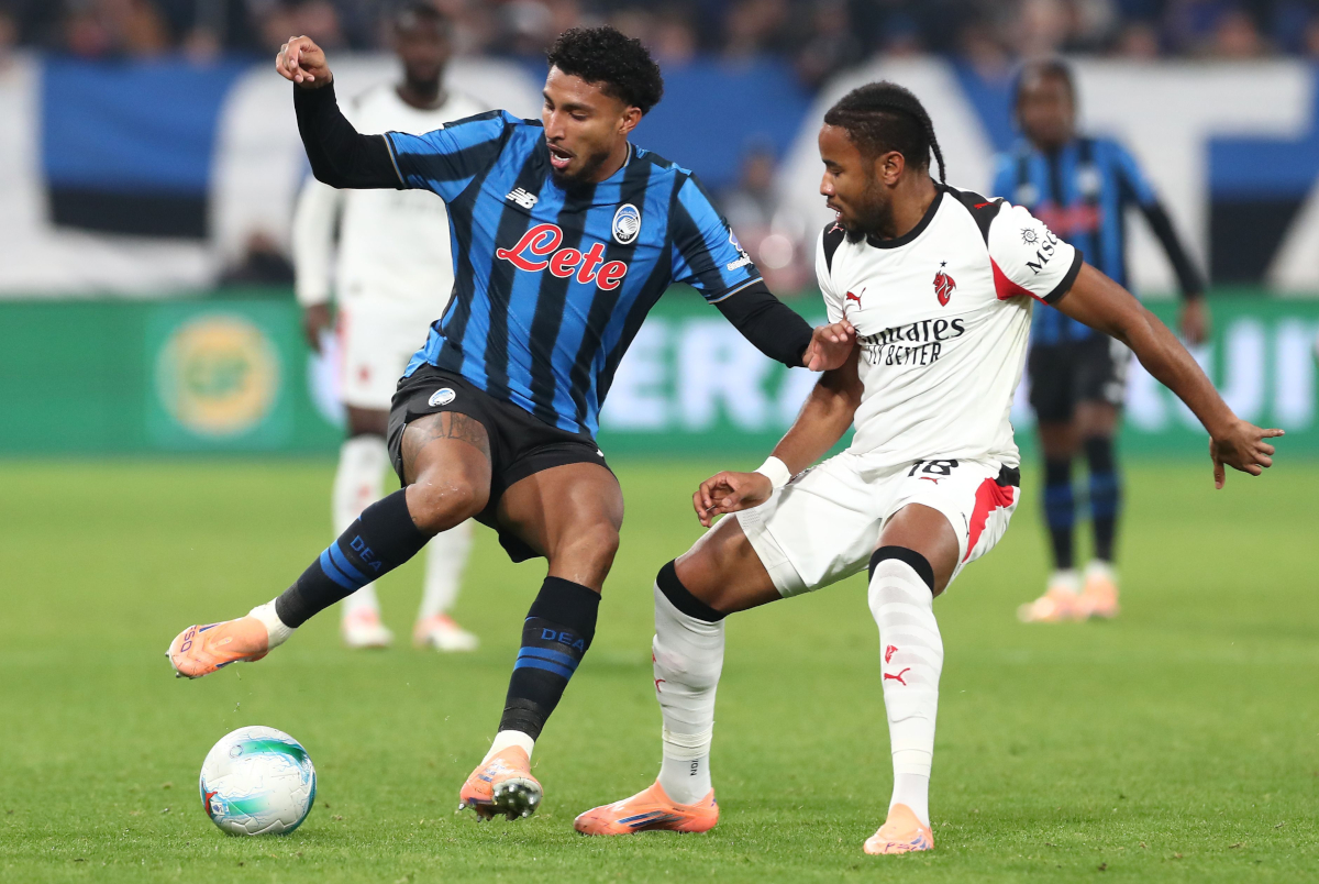BERGAMO, ITALY - OCTOBER 28: Ederson of Atalanta BC competes for the ball with Christopher Nkunku of AC Milan during the Serie A match between Atalanta BC and AC Milan at New Balance Arena on October 28, 2025 in Bergamo, Italy. (Photo by Marco Luzzani/Getty Images)