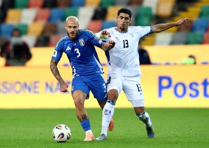 UDINE, ITALY - OCTOBER 14: Federico Dimarco of Italy battles for possession with Anan Khalaili of Israel during the FIFA World Cup 2026 qualifier match between Italy and Israel at Stadio Friuli on October 14, 2025 in Udine, Italy. (Photo by Marco Luzzani/Getty Images)