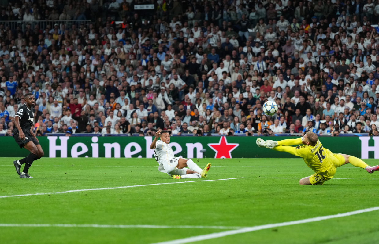 MADRID, SPAIN - OCTOBER 22: Michele Di Gregorio of Juventus saves a shot from Kylian Mbappe of Real Madrid during the UEFA Champions League 2025/26 League Phase MD3 match between Real Madrid C.F. and Juventus at Estadio Santiago Bernabeu on October 22, 2025 in Madrid, Spain. (Photo by Angel Martinez/Getty Images)