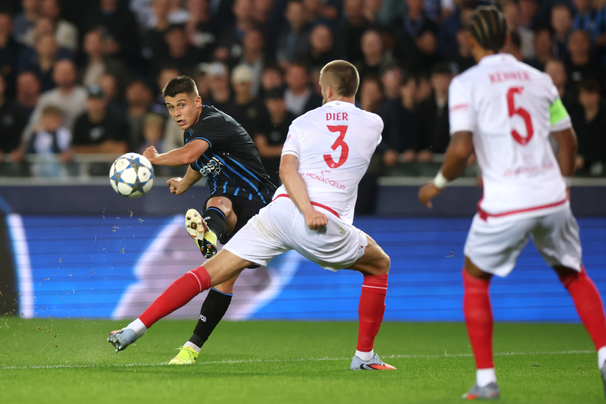 BRUGES, BELGIUM - SEPTEMBER 18: Nicolo Tresoldi of Club Brugge shoots on goal in front of Eric Dier of AS Monaco during the UEFA Champions League 2025/26 League Phase MD1 match between Club Brugge KV and AS Monaco at Jan Breydelstadion on September 18, 2025 in Bruges, Belgium. (Photo by Dean Mouhtaropoulos/Getty Images)
