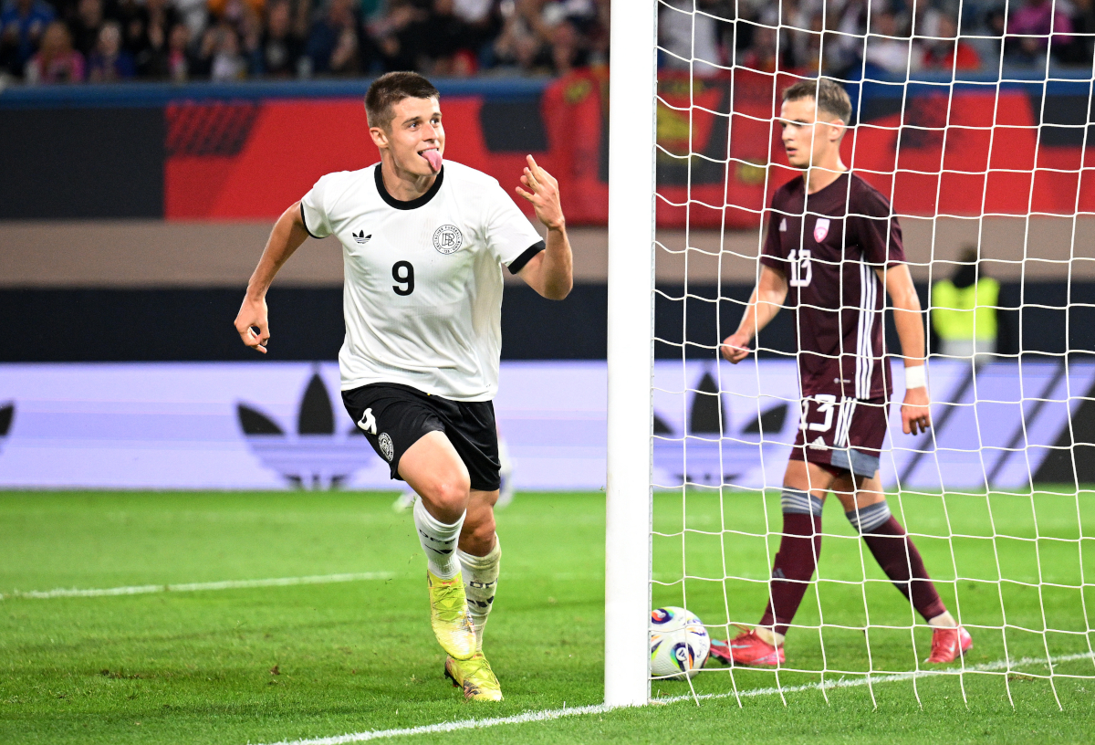 ROSTOCK, GERMANY - SEPTEMBER 09: Nicolo Tresoldi of Germany celebrates scoring his team's fourth goal to complete his hat-trick during the 2025 UEFA European Under-21 Championship Qualifier match between Germany U21 and Latvia U21 at Ostseestadion on September 09, 2025 in Rostock, Germany. (Photo by Stuart Franklin/Getty Images)